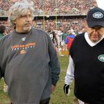 Rob and Rex Ryan walk off the field after the Jets win over the Browns.